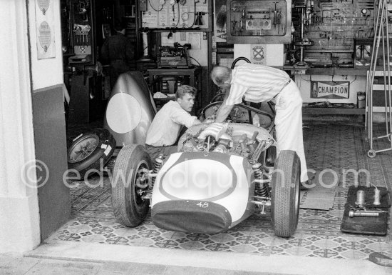 In a backstreet garage of Monte Carlo, Lance Reventlow, the driver-owner-constructor, helps to prepare his Scarab car for the race. Monaco Grand Prix 1960. - Photo by Edward Quinn