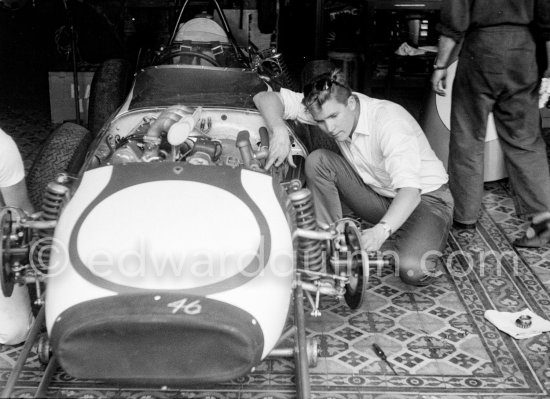 In a backstreet garage of Monte Carlo, Lance Reventlow, the driver-owner-constructor, helps to prepare his Scarab car for the race. Monaco Grand Prix 1960. - Photo by Edward Quinn