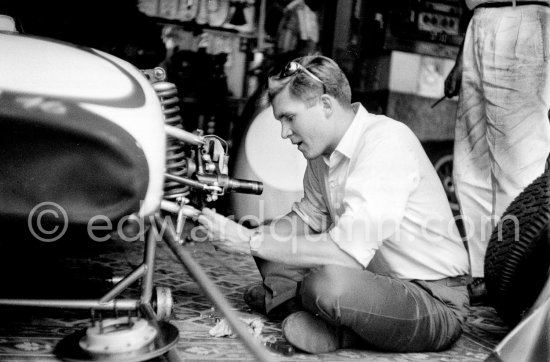 In a backstreet garage of Monte Carlo, Lance Reventlow, the driver-owner-constructor, helps to prepare his Scarab car for the race. Monaco Grand Prix 1960. - Photo by Edward Quinn