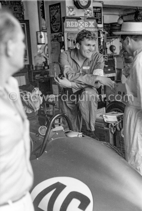 In a backstreet garage of Monte Carlo, Lance Reventlow, the driver-owner-constructor of Scarab cars talks with Jack Brabham. Monaco Grand Prix 1960. - Photo by Edward Quinn