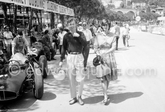 Pina, Tony Brooks Italian wife, carries an extra helmet and goggles for her husband. Monaco Grand Prix 1960. - Photo by Edward Quinn