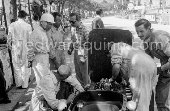 Stirling Moss, (28) Lotus 18. Colin Chapman, founder of Lotus Cars (with sunglasses). Monaco Grand Prix 1960. - Photo by Edward Quinn