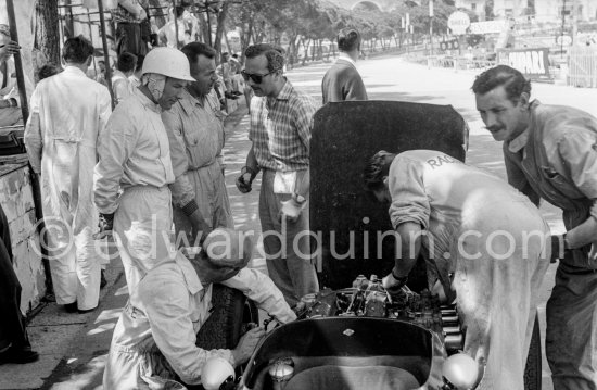 Stirling Moss, (28) Lotus 18. Colin Chapman, founder of Lotus Cars (with sunglasses). Monaco Grand Prix 1960. - Photo by Edward Quinn