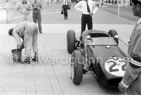 Innes Ireland pushes his N° 22 Lotus 18 uphill and right around the twisting Monaco circuit so that he can finish the race. His effort was repaid when he got 9th place and one point for the world championship. Monaco Grand Prix 1960. - Photo by Edward Quinn