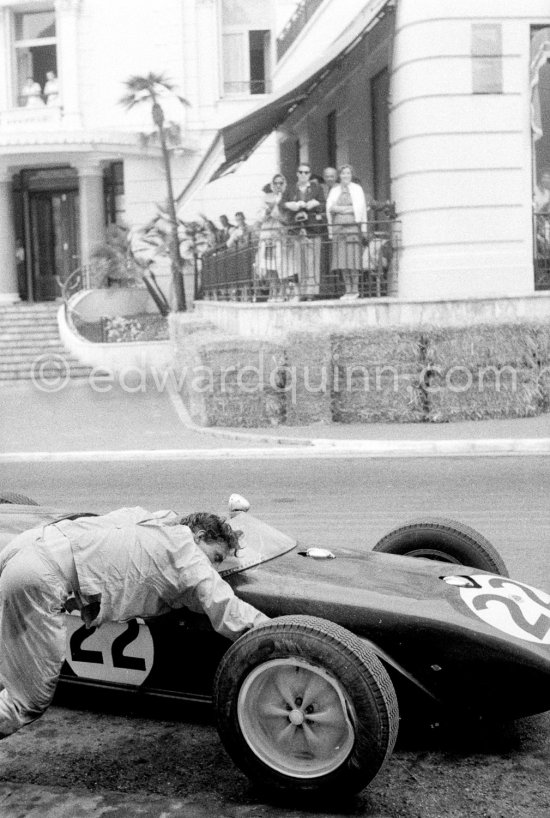 Innes Ireland pushes his N° 22 Lotus 18 uphill and right around the twisting Monaco circuit so that he can finish the race. His effort was repaid when he got 9th place and one point for the world championship. Monaco Grand Prix 1960. - Photo by Edward Quinn