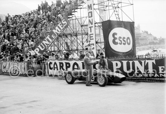 Innes Ireland pushes his N° 22 Lotus 18 uphill and right around the twisting Monaco circuit so that he can finish the race. His effort was repaid when he got 9th place and one point for the world championship. Monaco Grand Prix 1960. - Photo by Edward Quinn