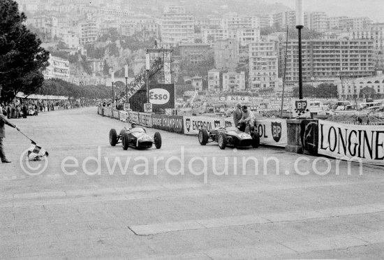 Innes Ireland pushes his N° 22 Lotus 18 uphill and right around the twisting Monaco circuit so that he can finish the race. His effort was repaid when he got 9th place and one point for the world championship. Monaco Grand Prix 1960. - Photo by Edward Quinn