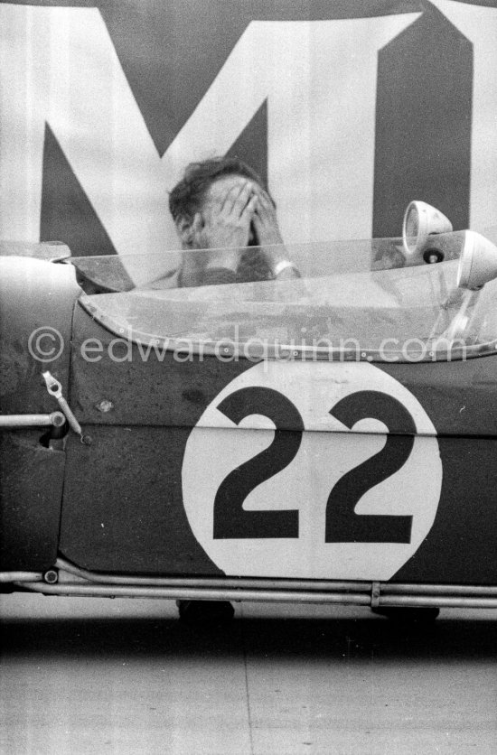 Innes Ireland pushes his N° 22 Lotus 18 uphill and right around the twisting Monaco circuit so that he can finish the race. His effort was repaid when he got 9th place and one point for the world championship. Monaco Grand Prix 1960. - Photo by Edward Quinn