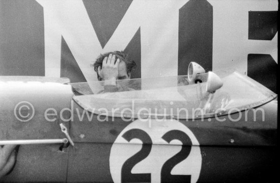 Innes Ireland pushes his N° 22 Lotus 18 uphill and right around the twisting Monaco circuit so that he can finish the race. His effort was repaid when he got 9th place and one point for the world championship. Monaco Grand Prix 1960. - Photo by Edward Quinn