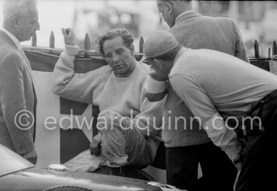 Innes Ireland pushes his N° 22 Lotus 18 uphill and right around the twisting Monaco circuit so that he can finish the race. His effort was repaid when he got 9th place and one point for the world championship. Monaco Grand Prix 1960. - Photo by Edward Quinn