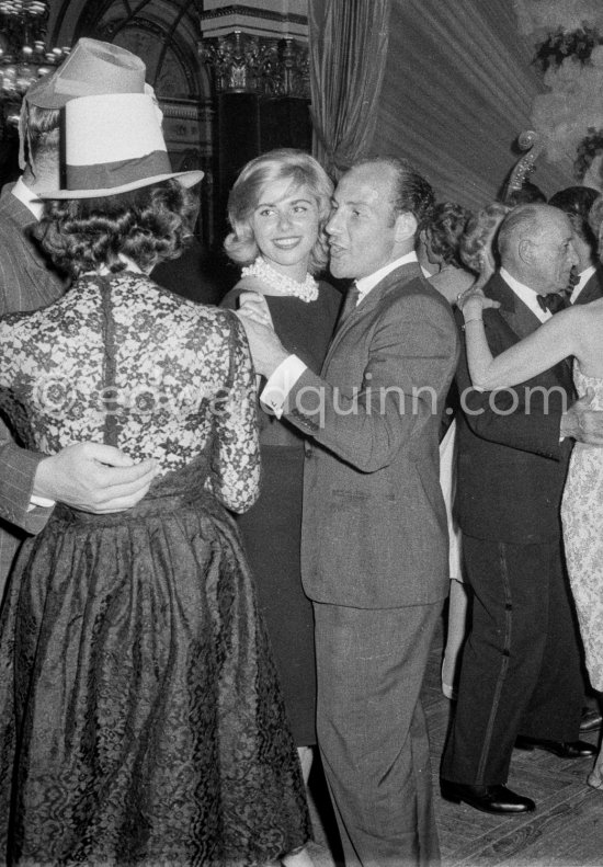 Stirling Moss, winner of the Grand Prix, gets into the party spirit as he dances with Swedish model Helga Mayerhoffer. Gala of Monaco Grand Prix 1960. - Photo by Edward Quinn