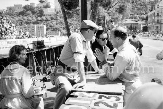 Stirling Moss, Rob Walker (hat), A.R.P. (Tony) Rolt who raced cars for Rob Walker in the 1950's. On the left Rob Walker's wife, Betty.Monaco Grand Prix 1961. - Photo by Edward Quinn