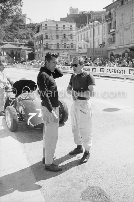 Olivier Gendebien (left) and Lucien Bianchi. Tony Brook\'s B.R.M.-Climax in the background. Monaco Grand Prix 1961. - Photo by Edward Quinn