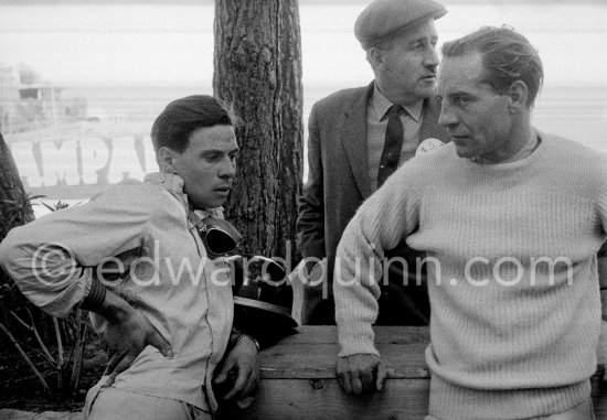 Jim Clark (left) after his crash looks disappointed as he talks with Innes Ireland after his crash. Behind them Esso Competition Manager Geoff Murdoch. Monaco Grand Prix 1961. - Photo by Edward Quinn