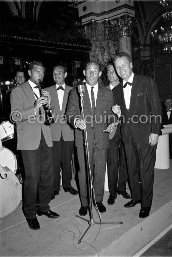 Asnatch of song from Stirling Moss as he joins in with Louis Frosio's (right) danceband in a Monaco nightspot after the Monaco Grand Prix 1961. - Photo by Edward Quinn