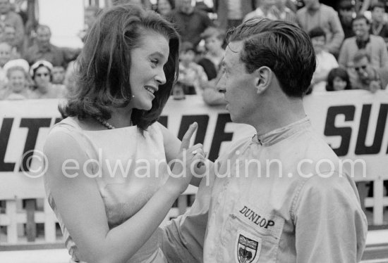 An American film company making the film "Love is a Ball" took advantage of the race to shoot some scenes. Here French actress Béatrice Altariba is with the British driver Jim Clark. Monaco Grand Prix 1962. - Photo by Edward Quinn