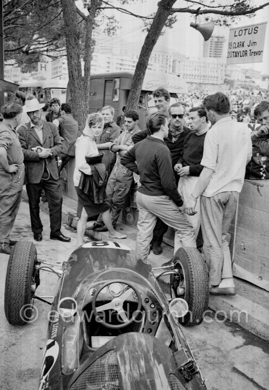 Jim Clark, (18) Lotus 25, and Colin Chapman (with sunglasses), founder of Lotus Cars. Monaco Grand Prix 1962. - Photo by Edward Quinn