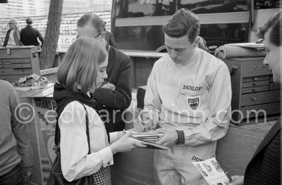 Jim Clark signing autopgraphs. Monaco Grand Prix 1964. - Photo by Edward Quinn