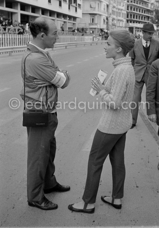 Stirling Moss, commentates for ABC Wide World of Sport (who is she?). Monaco Grand Prix 1964. - Photo by Edward Quinn