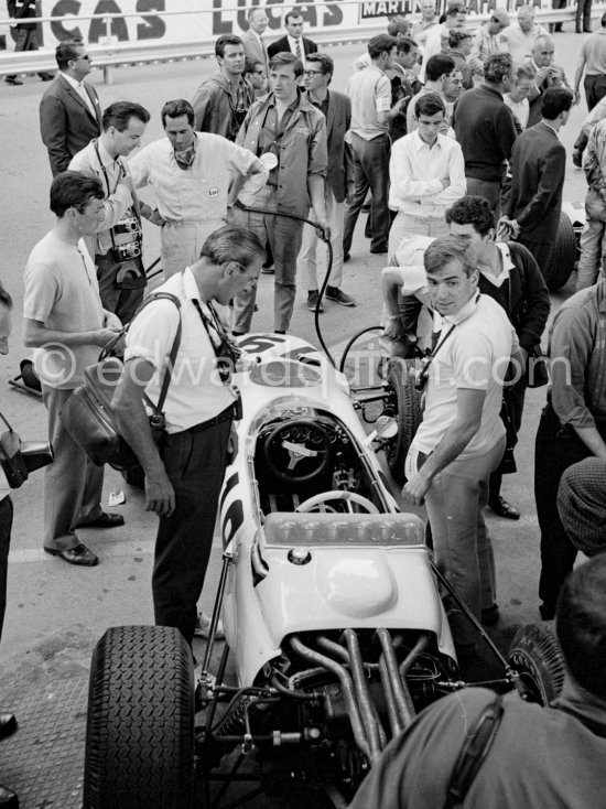 Jack Brabham is interested in Ronnie Bucknum's Honda RA272. Monaco Grand Prix 1965. - Photo by Edward Quinn