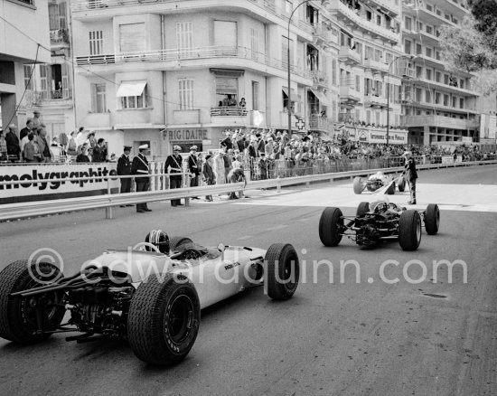 Ronnie Bucknum, (19) Honda RA272. Bruce McLaren, (7) Cooper T77 Climax. Monaco Grand Prix 1965. - Photo by Edward Quinn