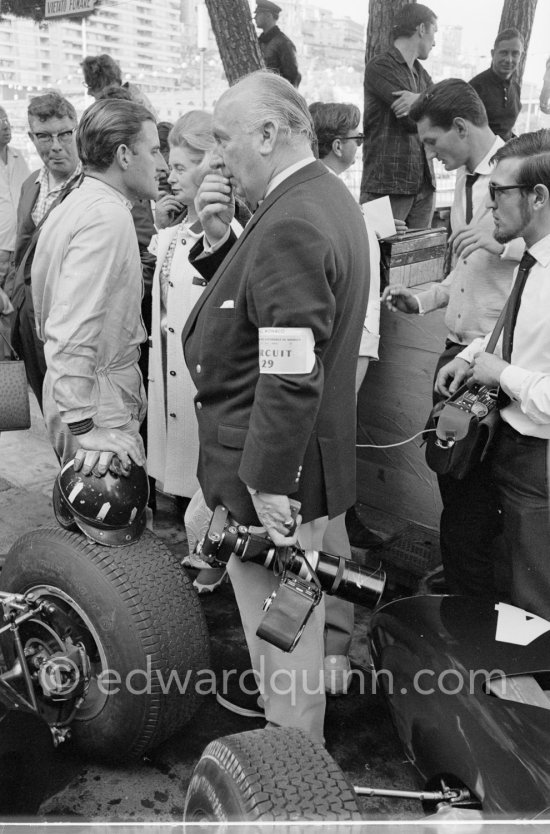 Graham Hill, Louis Stanley "Big Lou", B.R.M. chairman, and his wife. Monaco Grand Prix 1965. - Photo by Edward Quinn