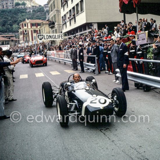Stirling Moss, Lotus 18 (winner GP Monaco 1961), behind him Piero Taruffi on a Ferrari 625 TF Vignale in the parade of the Club des Anciens Pilotes de Grand Prix, now Grand Prix Drivers Club GPDC. Monaco Grand Prix 1965. - Photo by Edward Quinn