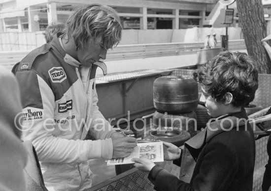 James Hunt signing autographs. Monaco Grand Prix 1978. - Photo by Edward Quinn