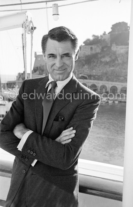 Cary Grant on board Onassis\' yacht Christina. Monaco harbor 1957. - Photo by Edward Quinn