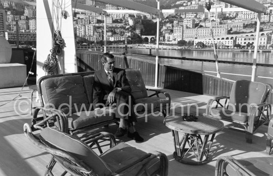 Cary Grant on board Onassis\' yacht Christina. Monaco harbor 1957. - Photo by Edward Quinn