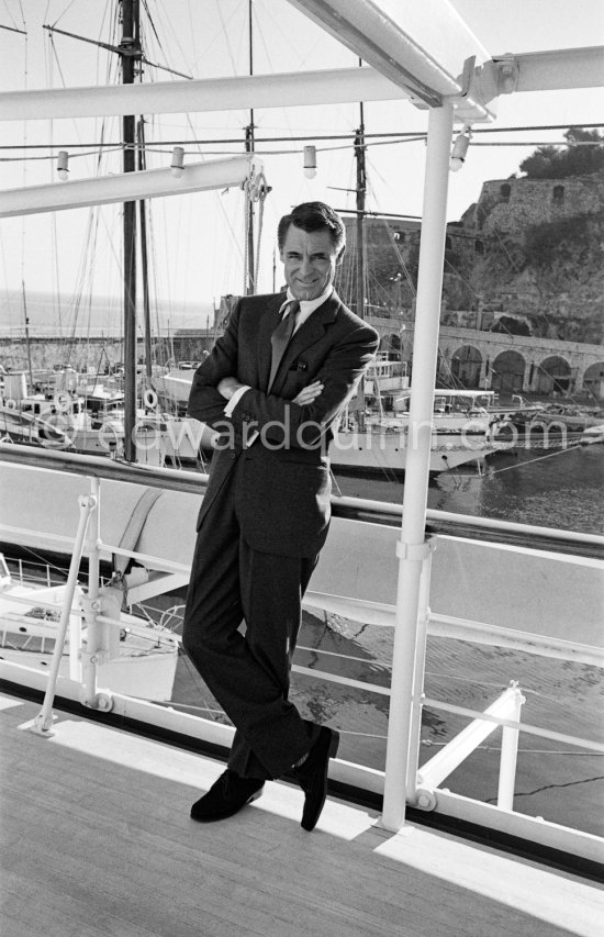 Cary Grant on board Onassis\' yacht Christina. Monaco harbor 1957. - Photo by Edward Quinn