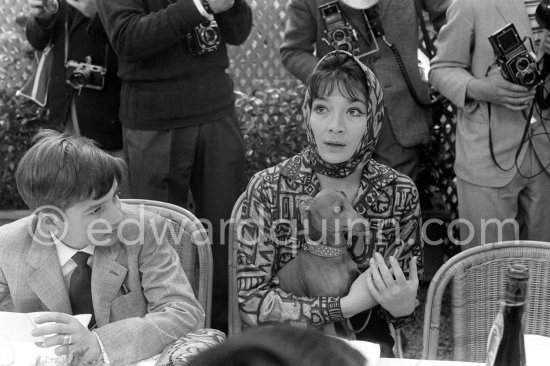 Jean-Pierre Léaud and Juliette Gréco with her dog at the Cannes Film Festival. Cannes 1959. - Photo by Edward Quinn