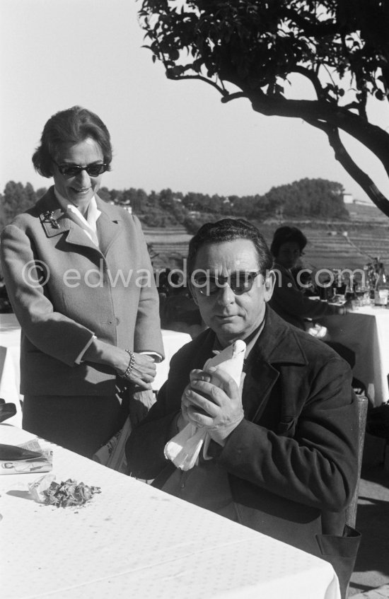 The painter Hans Hartung carefully holding a dove. Standing beside him his wife Anna-Eva Bergman. Saint-Paul-de-Vence 1961. - Photo by Edward Quinn