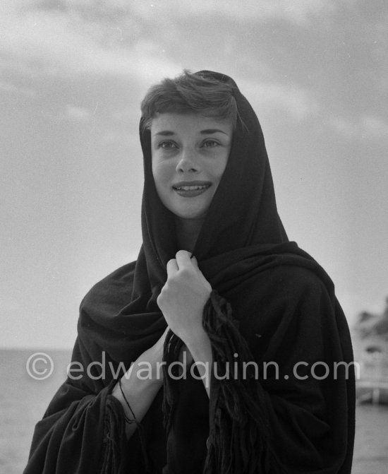 Hollywood actress Audrey Hepburn, before she found fame, at the harbor of Monaco 1951. - Photo by Edward Quinn