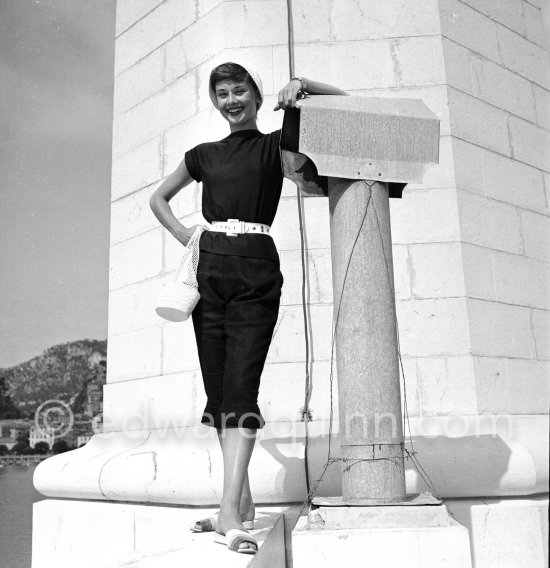 Hollywood actress Audrey Hepburn, before she found fame, at the harbor of Monaco 1951. - Photo by Edward Quinn