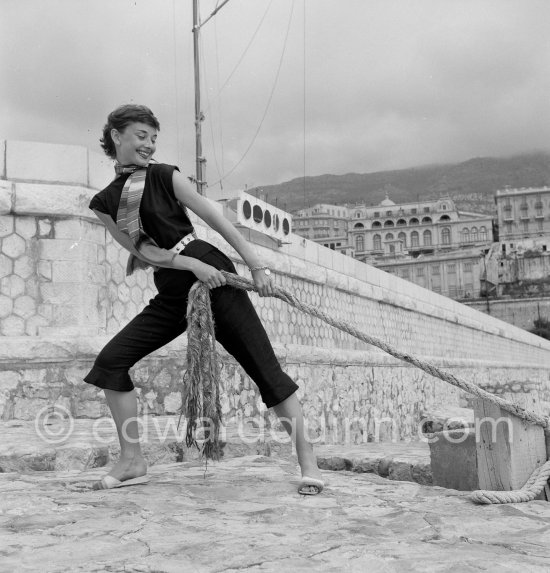 Hollywood actress Audrey Hepburn, before she found fame, at the harbor of Monaco 1951. - Photo by Edward Quinn