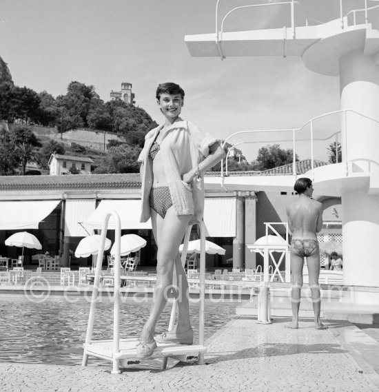 Audrey Hepburn in Monaco for the film "Monte Carlo Baby". She was at the beginning of her career and willingly posed for the photographer. Monte Carlo Beach 1951. - Photo by Edward Quinn