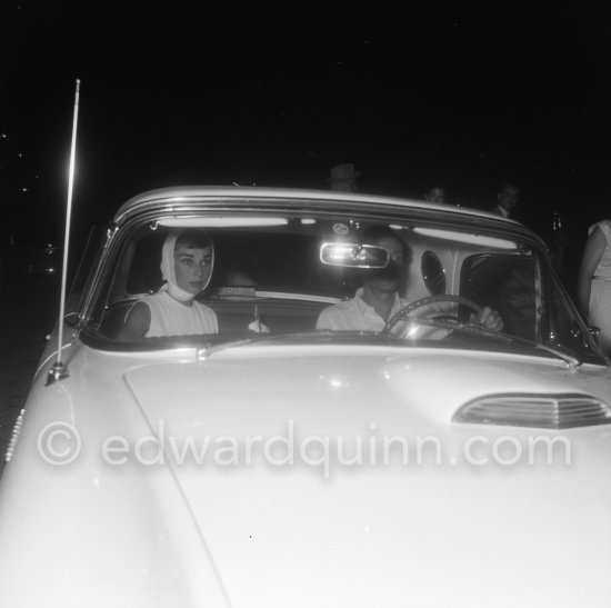 Audrey Hepburn and husband Mel Ferrer. Eden Roc Hotel, Cap d'Antibes 1956. Car: Ford Thunderbird Hardtop with portholes. 1956 (spare wheel outside) - Photo by Edward Quinn