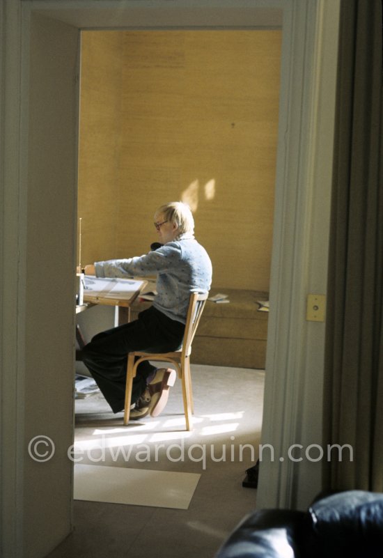 David Hockney working on the set design for "The Rake's Progress" at England’s Glyndebourne Opera Festival Paris 1975. 1975. - Photo by Edward Quinn