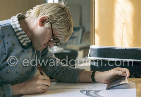 David Hockney working on the set design for "The Rake's Progress" at England’s Glyndebourne Opera Festival Paris 1975. - Photo by Edward Quinn