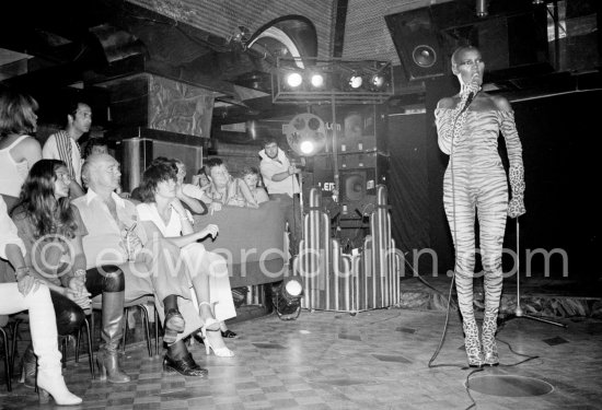 Grace Jones, American singer-performer and Eddy Barclay, French bandleader and owner of a record company at Hotel Byblos. Saint-Tropez 1978. - Photo by Edward Quinn