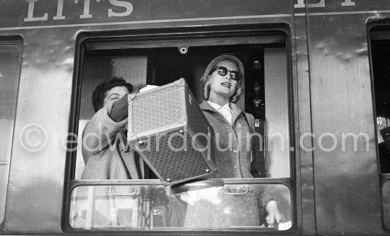 Grace Kelly arriving at Cannes station 1955.With her is her friend Gladys de Ségonzac who had helped her with the wardrobe on "To catch a thief". - Photo by Edward Quinn