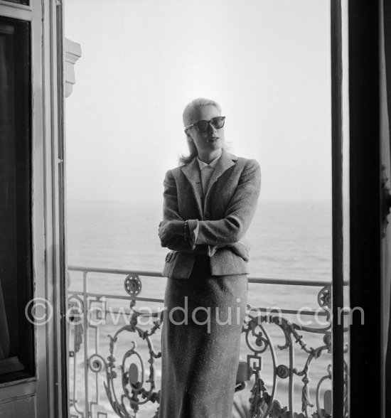 Grace Kelly on the balcony of her room in the Carlton Hotel. Cannes Film Festival 1955. - Photo by Edward Quinn