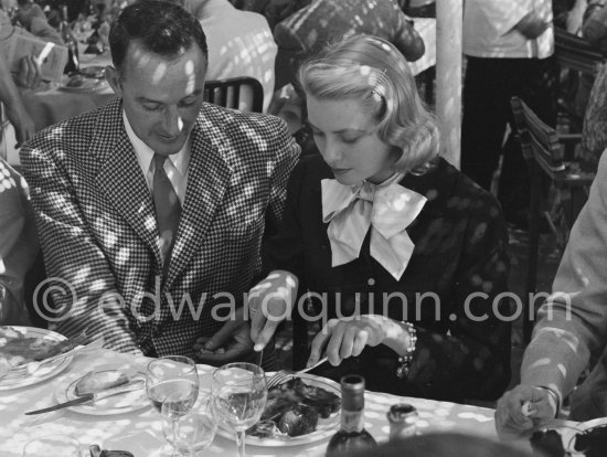 A cup of coffee for Grace Kelly at the Cannes Film Festival. On the left Rupert Allan. Cannes 1955. - Photo by Edward Quinn