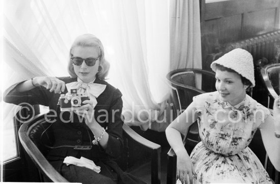 Grace Kelly photographs Françoise Arnoul with Leica IIIf Nr. 695 137 with Winder Leicavit of Edward Quinn, Cannes 1955. - Photo by Edward Quinn