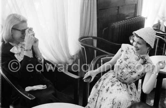 Grace Kelly photographs Françoise Arnoul with Leica IIIf Nr. 695 137 with Winder Leicavit of Edward Quinn, Cannes 1955. - Photo by Edward Quinn