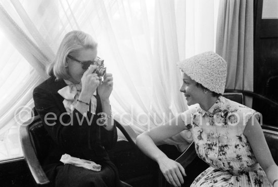 Grace Kelly photographs Françoise Arnoul with Leica IIIf Nr. 695 137 with Winder Leicavit of Edward Quinn, Cannes 1955. - Photo by Edward Quinn