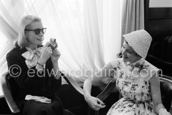 Grace Kelly photographs Françoise Arnoul with Leica IIIf Nr. 695 137 with Winder Leicavit of Edward Quinn, Cannes 1955. - Photo by Edward Quinn