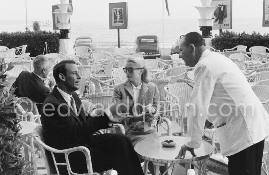 Grace Kelly and Gordon White, chairman of Hanson Industries, on the terrasse of the Carlton Hotel. Cannes Film Festival 1955. - Photo by Edward Quinn