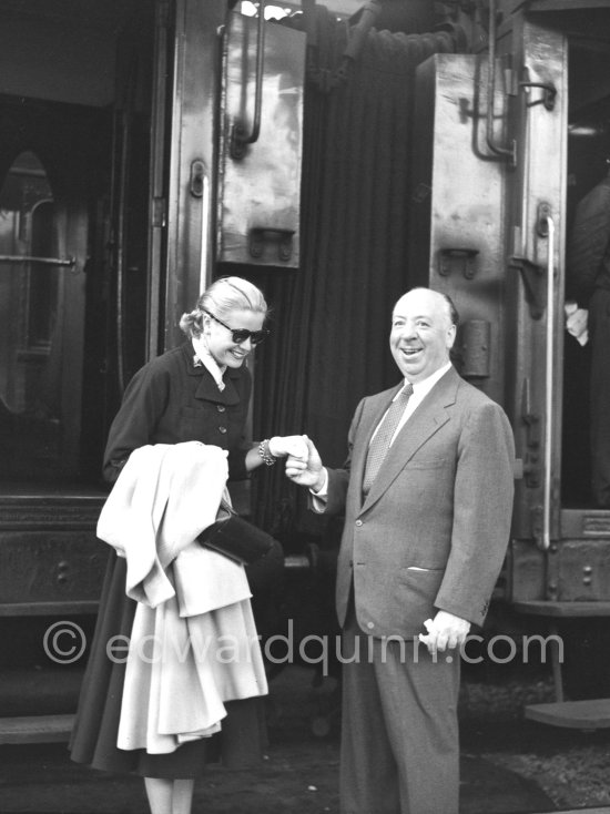 Grace Kelly arriving at the Cannes Railway Station, met by Alfred Hitchcock. It was the third time she was in Europe. In 1947 she came with the family, in 1949 on assignement, she was then a fashion model. Cannes 1954. - Photo by Edward Quinn